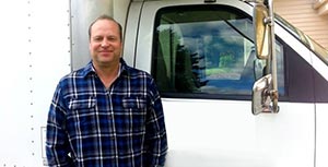 Flinn is one of our Kirkland plumbing contractors and he stands ready by his truck